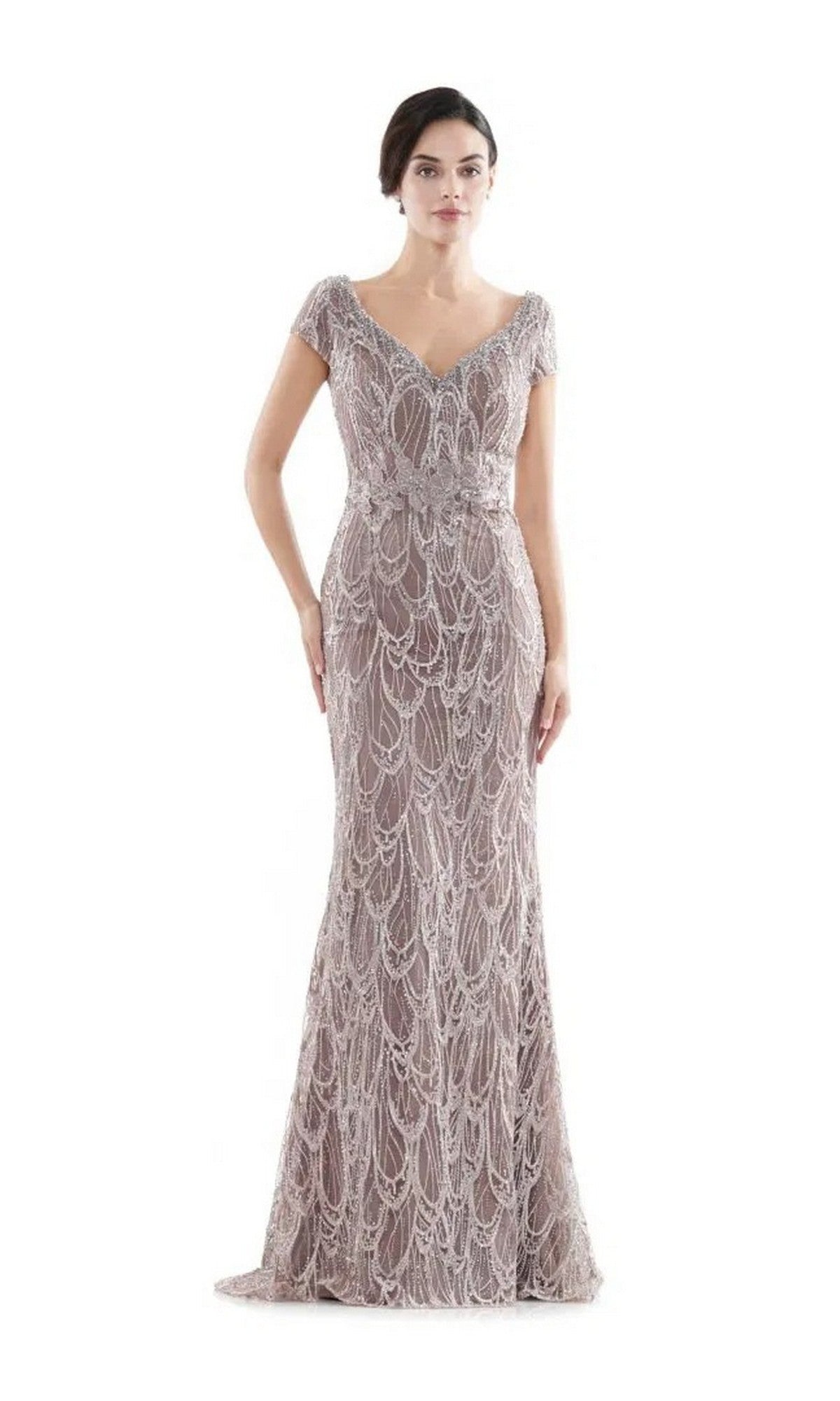 A woman stands against a white background in the Rina Di Montella RD2716 long formal dress, featuring cap sleeves, a floor-length beaded design, and a subtle mermaid silhouette.